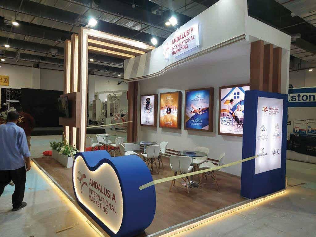 Custom exhibition stand with curved counter built by The Task in Cairo