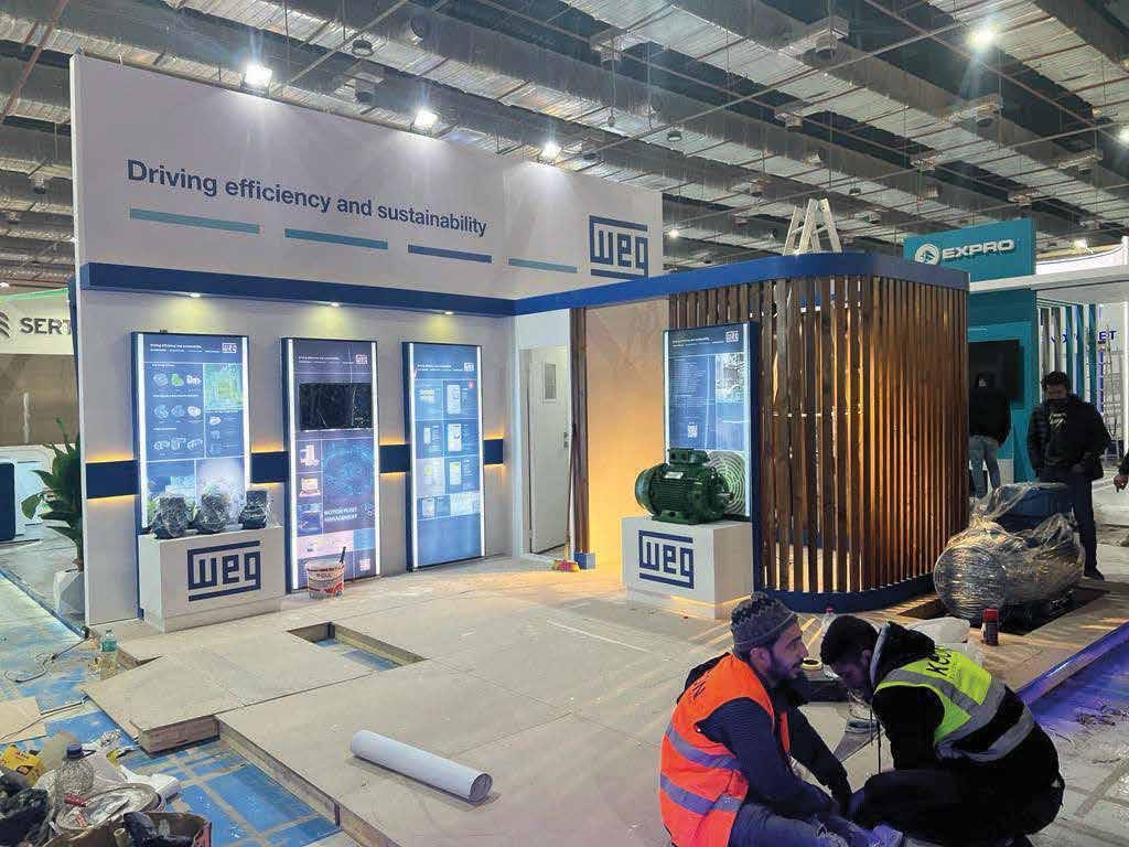 Machinery exhibitor stand with lit display walls built by The Task