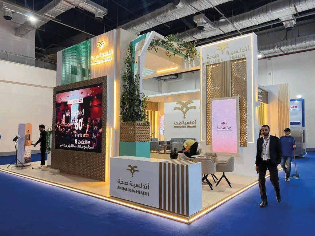 Feature stand with greenery and lit branding built by The Task